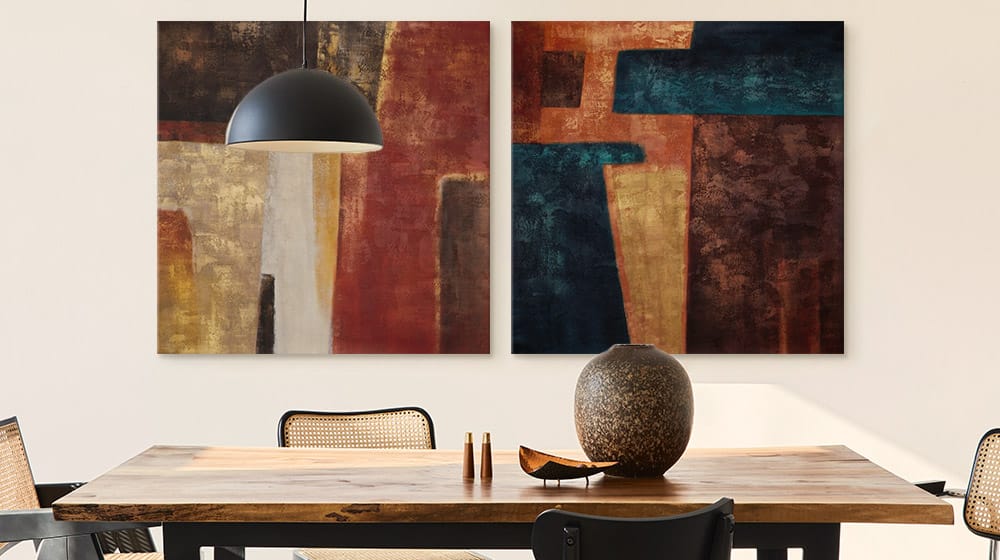 Two warm abstract canvas prints in a contemporary dining room