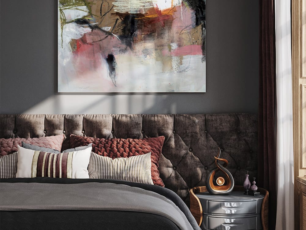Soft abstract canvas print over the bed in a sunny bedroom