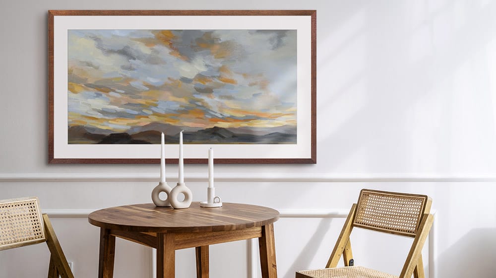 Abstract landscape in a walnut frame in a neutral dining room