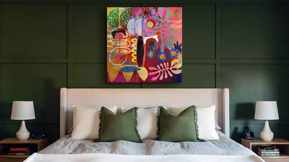 Colorful bohemian abstract in a deep green bedroom