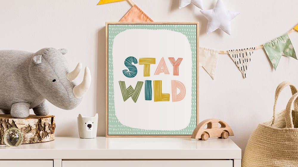 Natural float frame typography print on the dresser in a neutral children's room