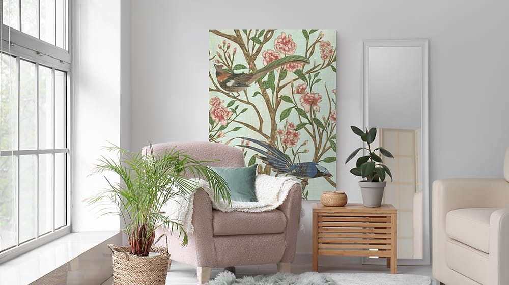 Oversized floral and bird wall art demonstrating how large artwork can enhance a small seating area