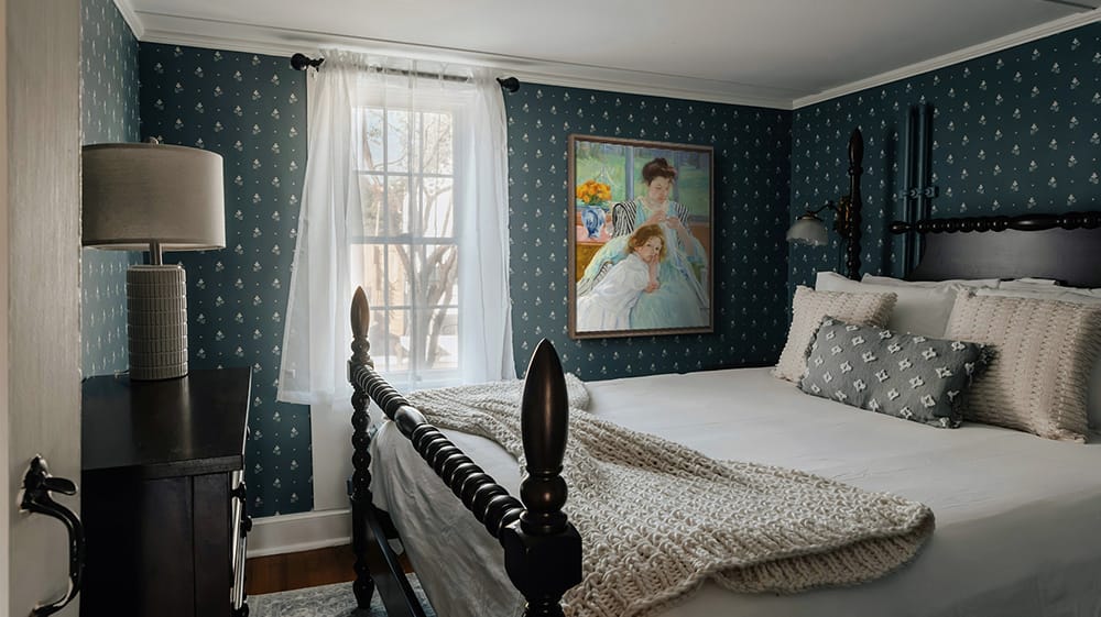 Wall art for standard ceiling height bedroom placed at eye level with balanced spacing above the bed and surrounding decor