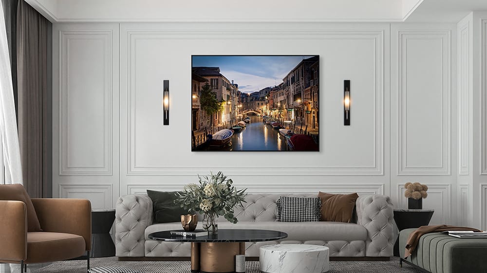 Wall art for high ceilings scaled to fill wall space and centered above a sofa creating balance and visual impact in a large living room