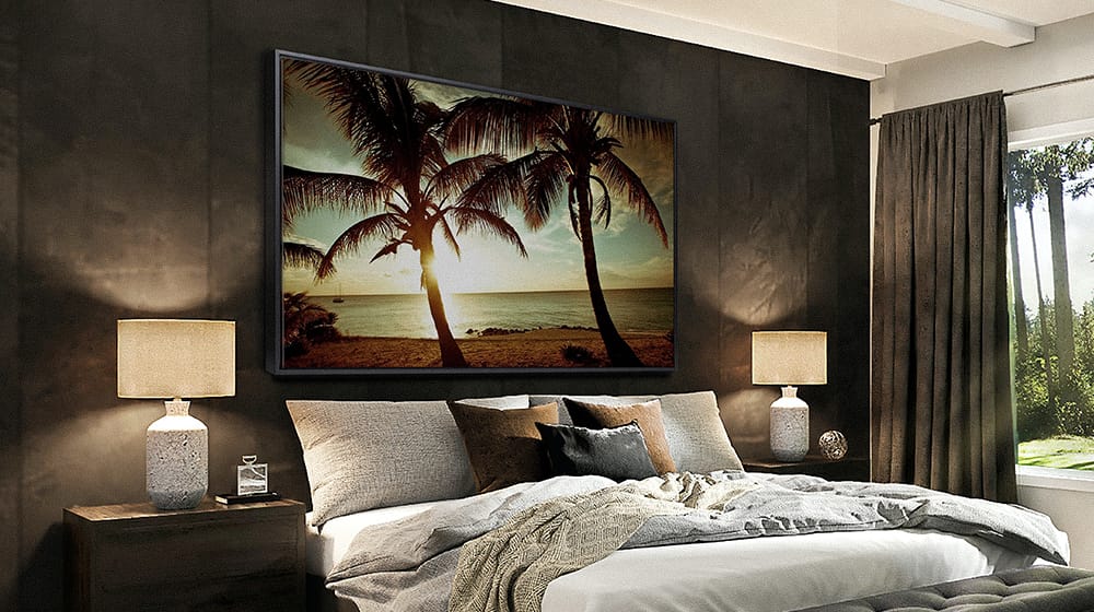 Large tropical sunset canvas wall art above a bed creating a bold focal point in a small bedroom