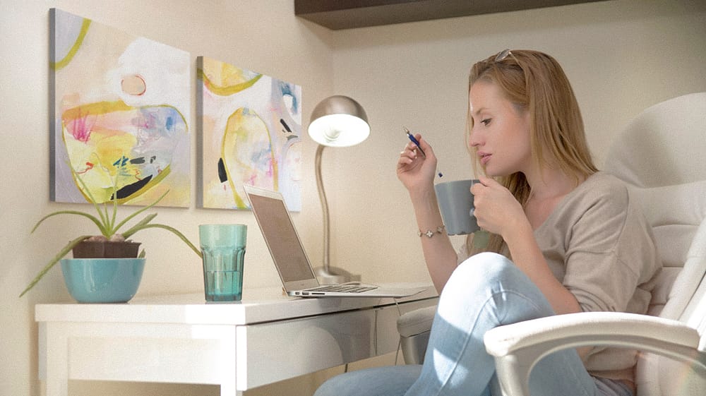 Dorm desk styled with abstract wall art, showing how soft colors and modern prints create a calm and inspiring study space