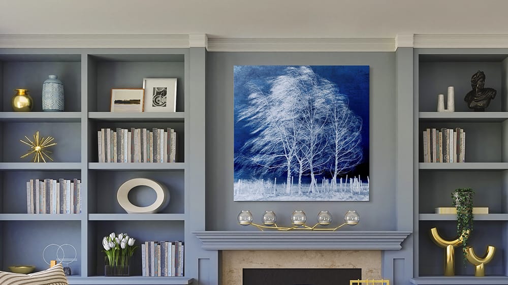 Blue wall art above fireplace in sophisticated living room, demonstrating calming blue tones and atmospheric interior styling