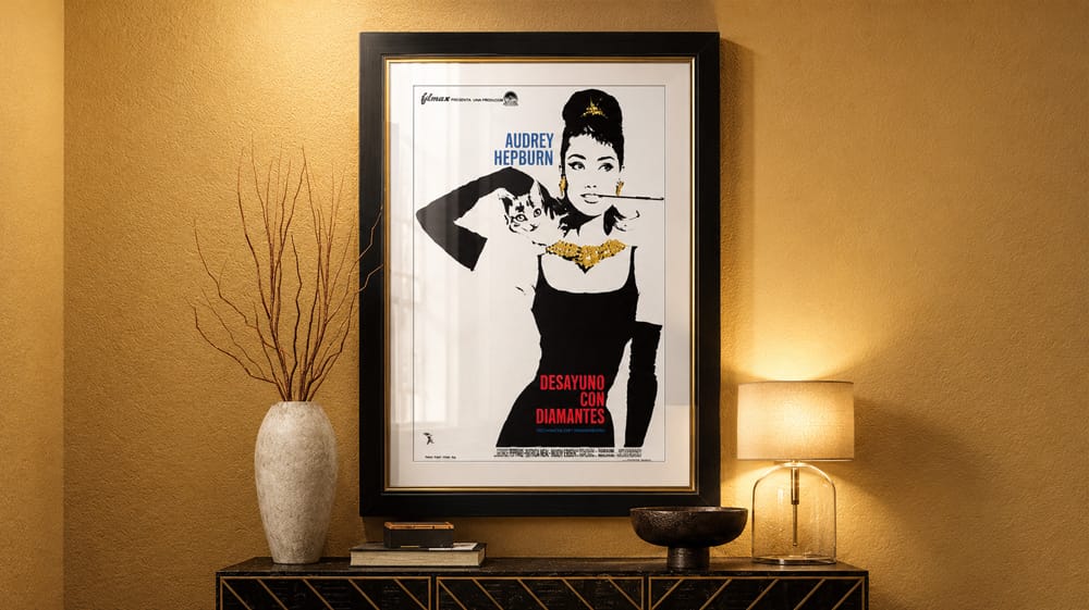Framed Breakfast at Tiffany's movie poster above console table, demonstrating how classic movie artwork can elevate home decor with timeless Hollywood style