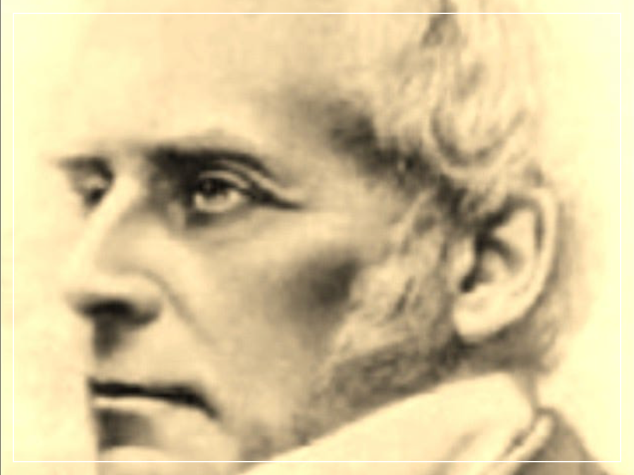 A man with white hair and late-Victorian style hair and clothes gazes to the left, his face in profile.