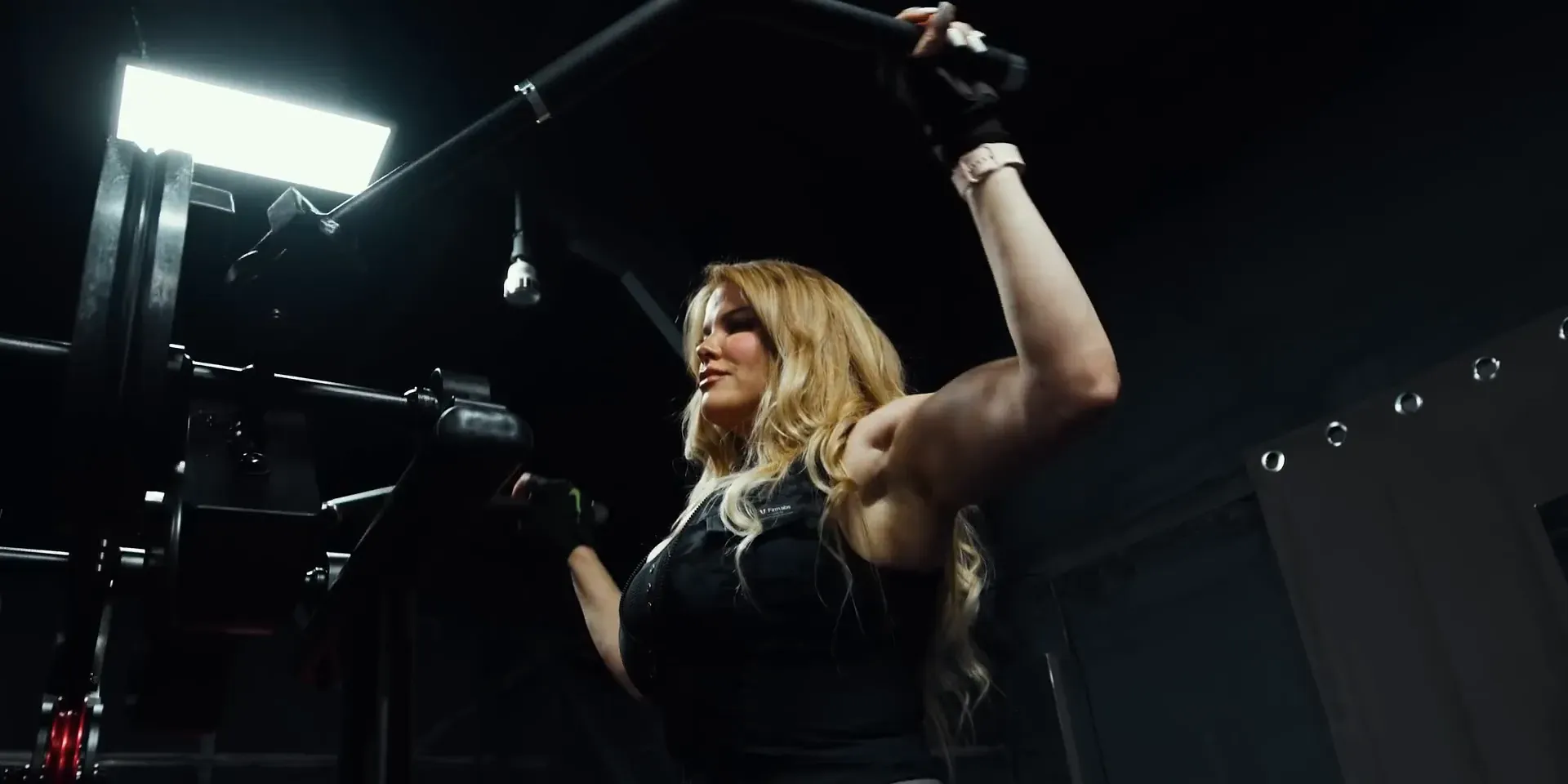 Demonstrating proper form for lateral raises