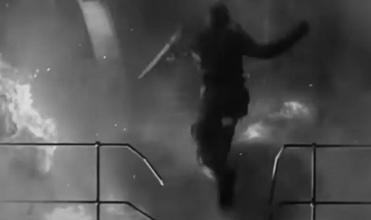 Captain Steve Rogers, aka "Captain America," leaps across a burning munitions factory/prison in World War II Germany.