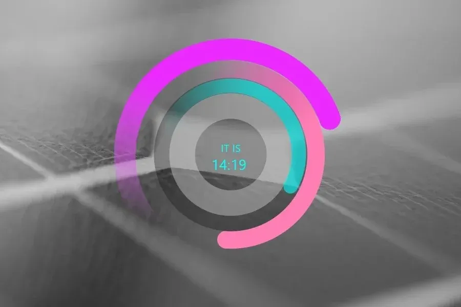 Source preview of RKS Dreamz: A digital clock surrounded by three rotating colored stripes representing seconds, minutes and hours