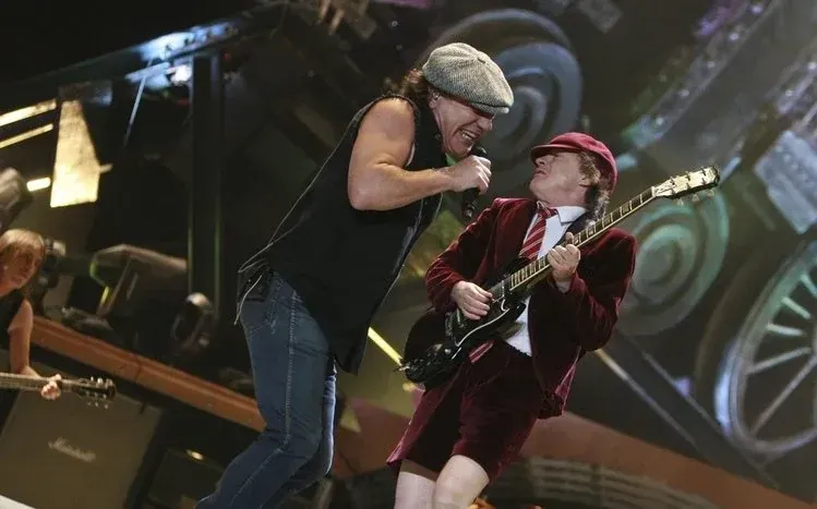 AC/DC band and stage imagery with a Highway to Hell theme.