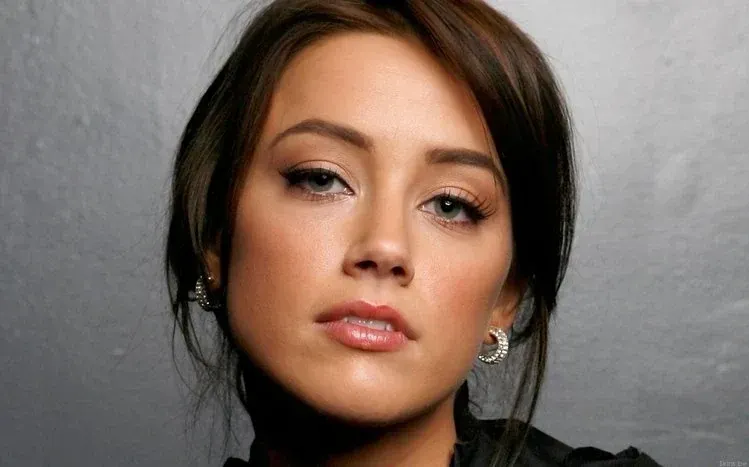 Amber Heard photographs showing varied moods and expressions.