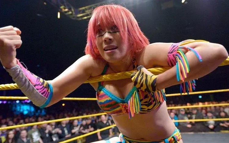 Asuka wallpaper collection featuring real-life wrestling action.