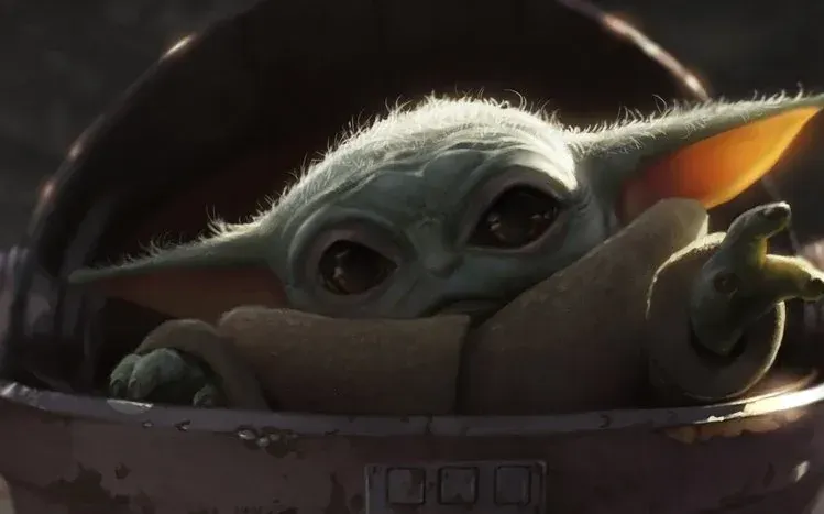 Baby Yoda shown in different poses, with emphasis on his eyes.