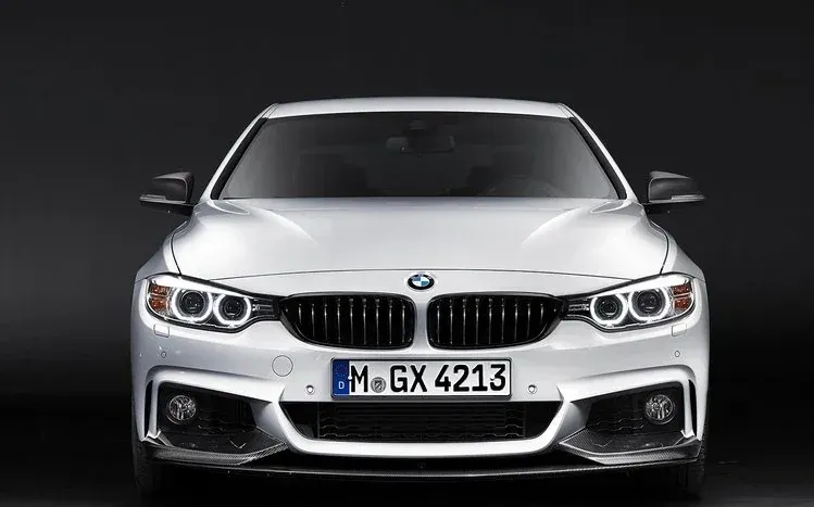 BMW M4 coupe wallpapers featuring different colors, designs, and photographic effects.
