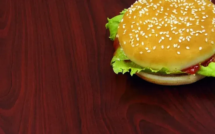 Burger wallpaper collection featuring layered buns and fillings.