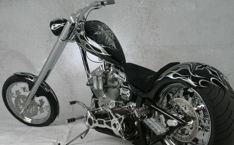 Customized chopper motorcycles on grass, in garages, and on roads, with close-up angles.