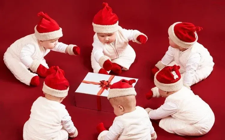 Christmas Babies collection featuring photographs of babies and young children.