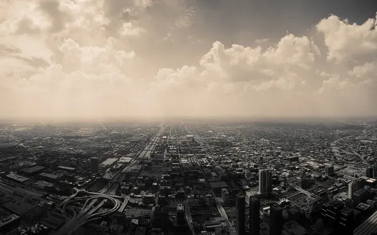 Dark city wallpaper imagery with visible urban lights.