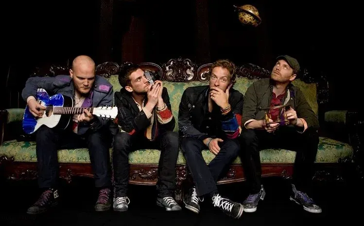 Coldplay band photographs, live-show imagery, and music-related abstract artwork.