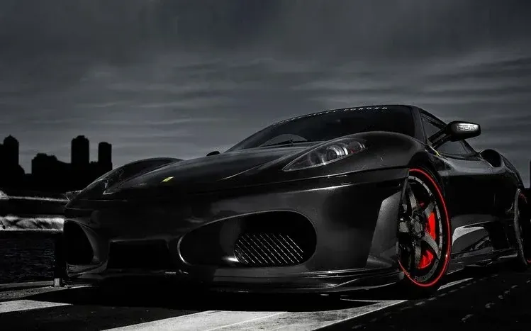 Dark-colored luxury cars from brands including Lamborghini, Audi, Aston Martin, Maserati and Lexus.