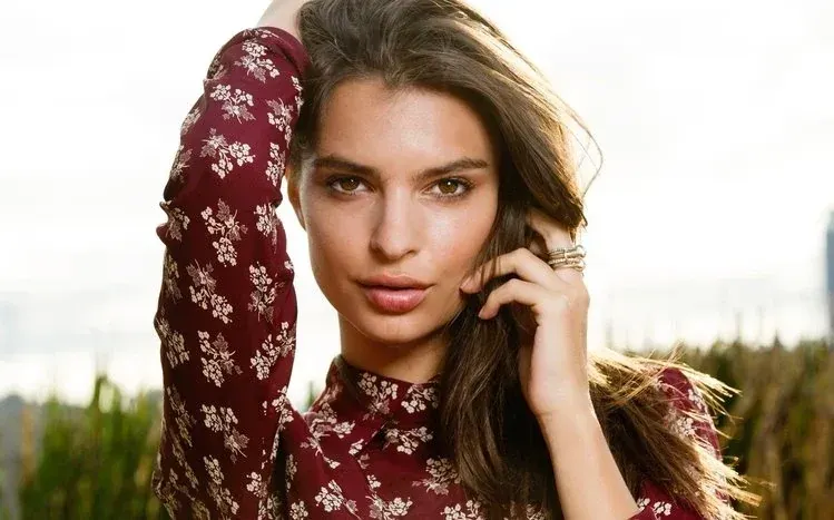 Emily Ratajkowski imagery featuring stylish clothing, her face, and her smile.