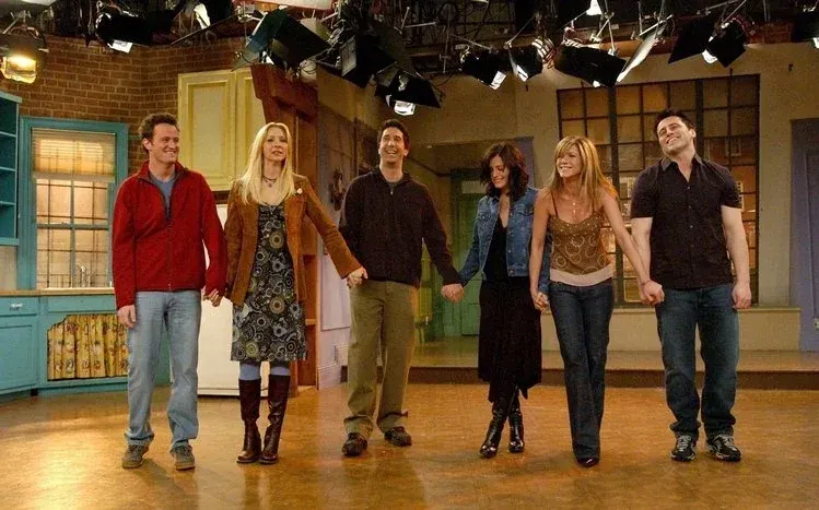 Friends stills showing Joey, Chandler, Ross, Monica, Rachel, and Phoebe smiling and relaxing together.