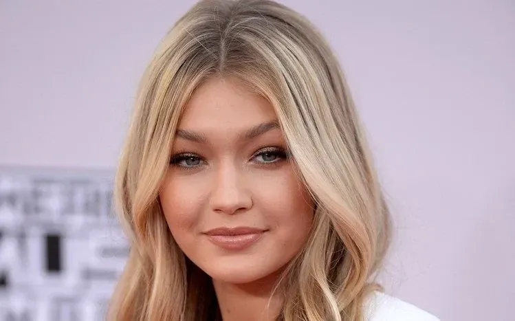 Gigi Hadid photographs with varied scenic settings and natural photography.