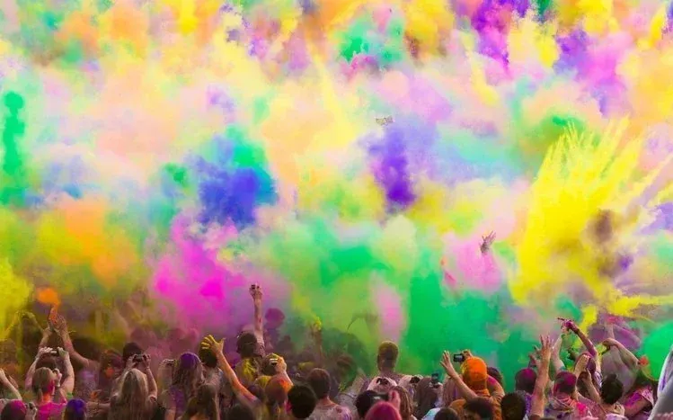 Holi wallpapers combining multicolored blends with real-life imagery.