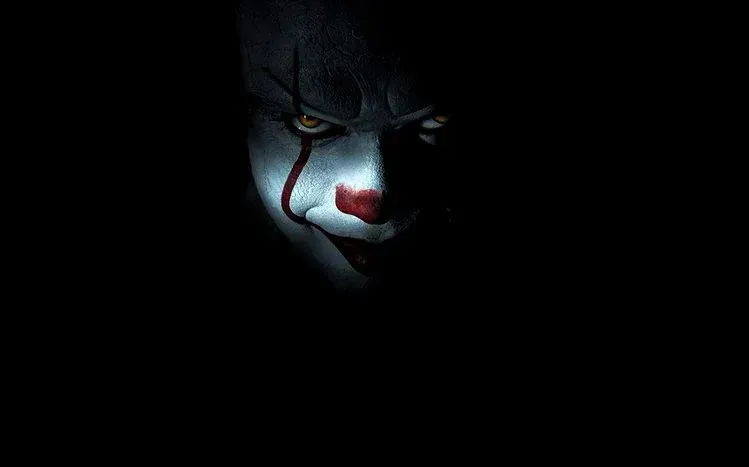 Pennywise the clown imagery from It.
