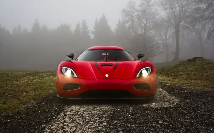 Koenigsegg Agera wallpapers showing the sports car from different angles and locations.