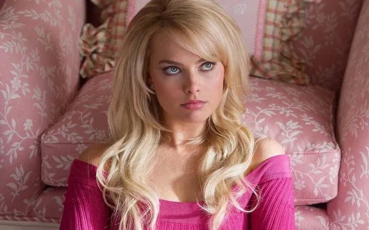 Margot Robbie in varied poses and fashionable attire across different occasions.