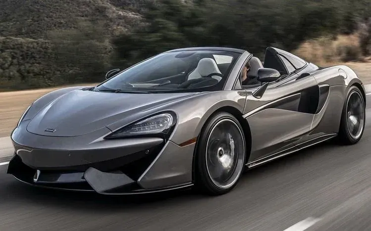 McLaren 570S Spider wallpapers in varied angles and colors, including blue, yellow, and orange.