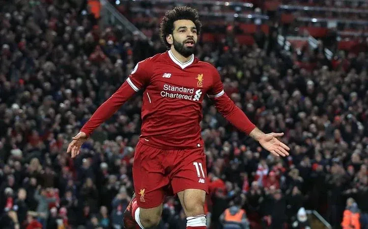 Mohamed Salah on the football field in Liverpool jerseys, in action and happy moods.