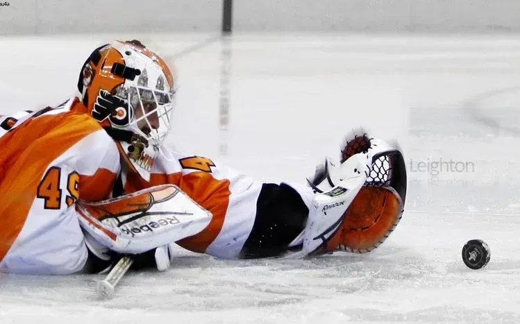 Philadelphia Flyers wallpapers featuring orange and black colors and the team logo.