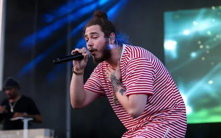 Post Malone wallpaper collection featuring the musician known for his facial tattoos.