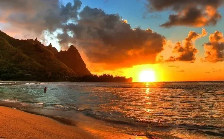 Seaside views of the sun setting over the sea.