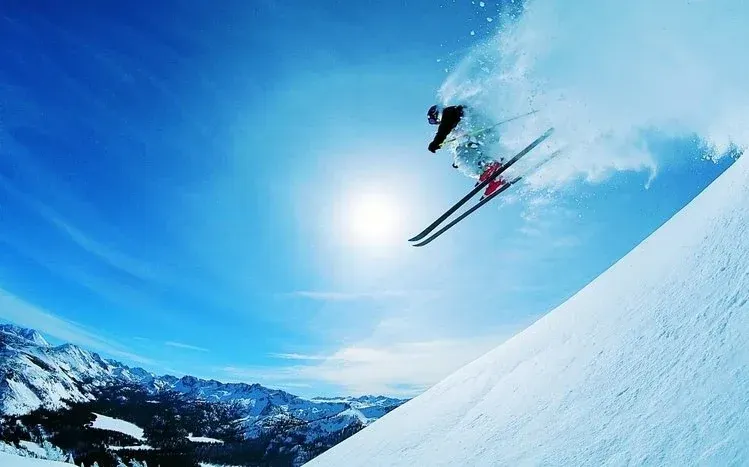 Skiing-themed imagery for a winter-sport wallpaper collection.