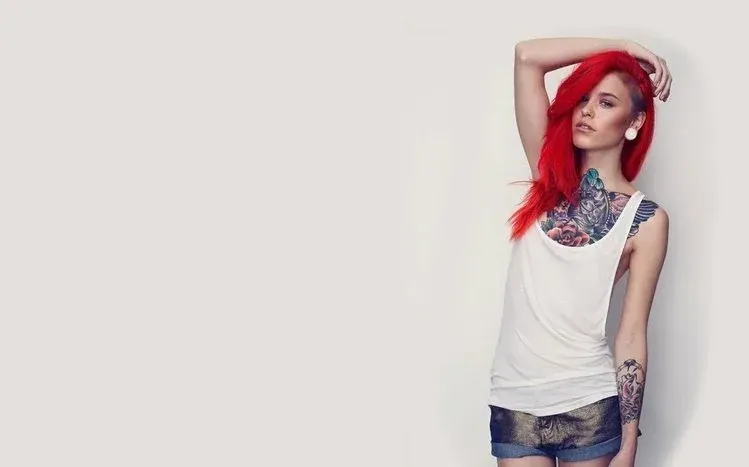 Models displaying intricate tattoo designs in a body-art wallpaper collection.