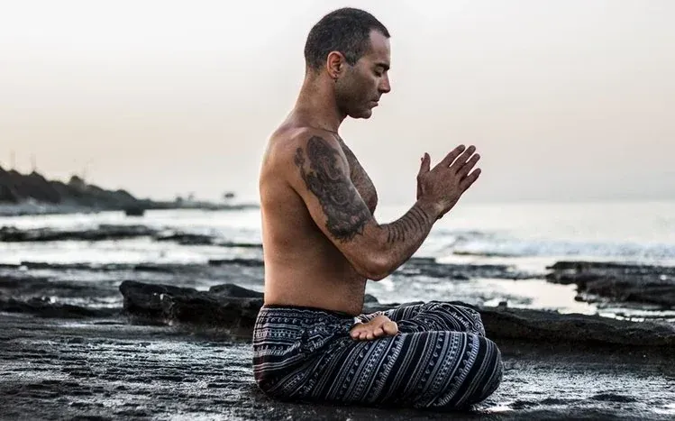 Individuals in yoga poses in neutral and colorful compositions, including beach and forest settings.