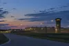 Conceptual editorial view of a generic correctional complex at dusk