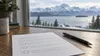 A generic unmarked ballot and pen on a desk overlooking a snowy Alaska mountain landscape.