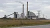 Unbranded coal-fired power station and transmission lines under natural overcast daylight in Michigan