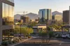 Phoenix-area office buildings, construction and desert mountains in early morning light