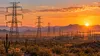 Illustrative view of high-voltage power infrastructure crossing Arizona’s desert landscape.