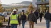 Workers arrive at an Arkansas commercial and light-industrial workplace on an early autumn morning.