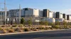 Illustrative view of a modern California data center with electrical equipment and drought-tolerant landscaping.
