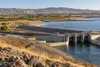 Conceptual view of a large off-stream reservoir and water-control structures in California’s dry interior.
